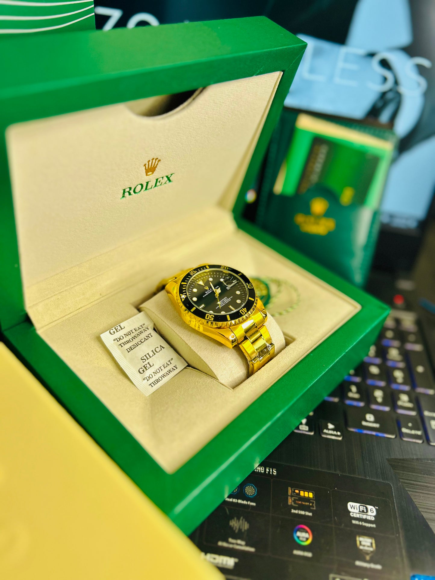 Black Submariner Dial Watch with Gold Chain & Original Rolex Box