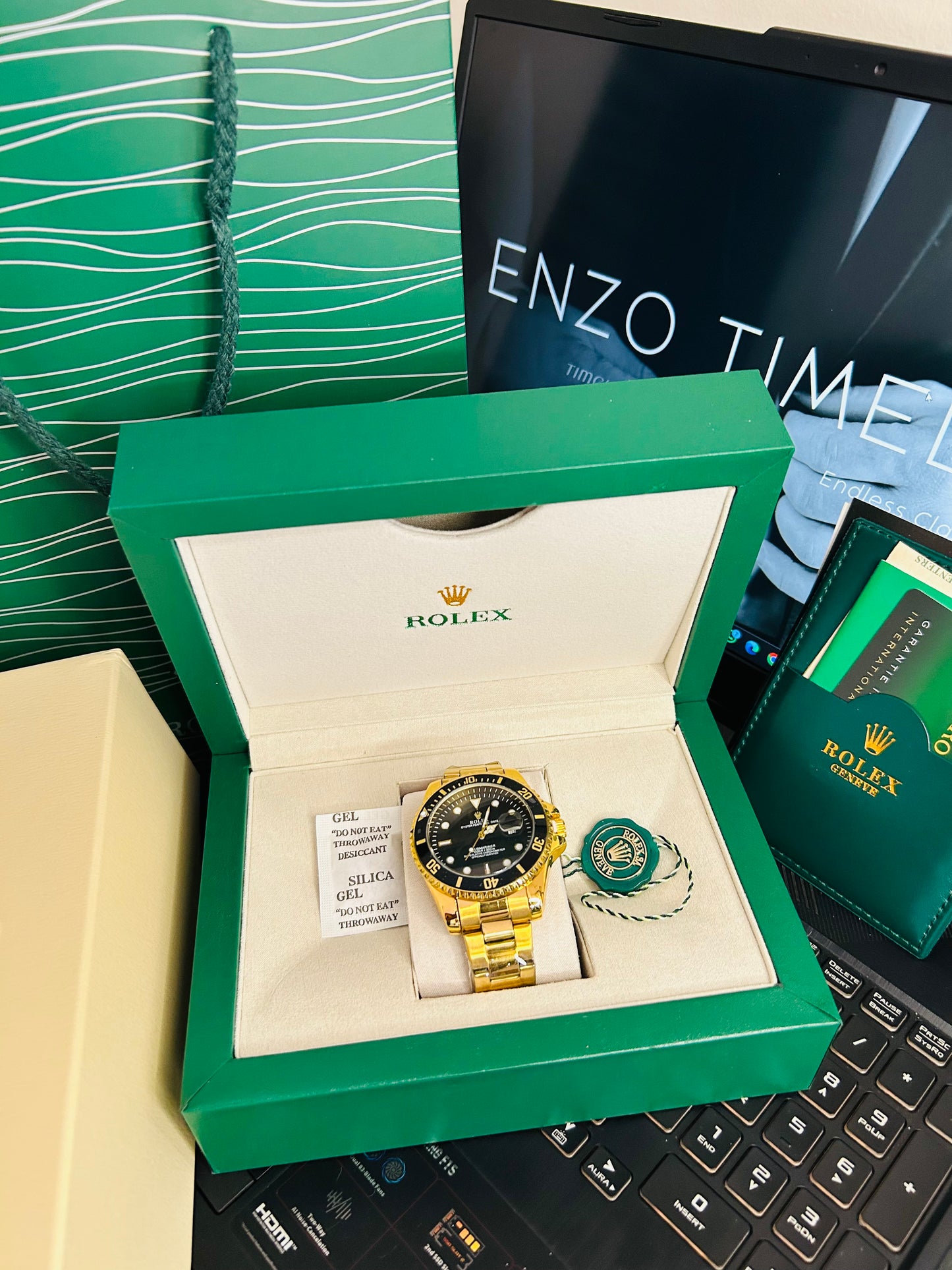 Black Submariner Dial Watch with Gold Chain & Original Rolex Box
